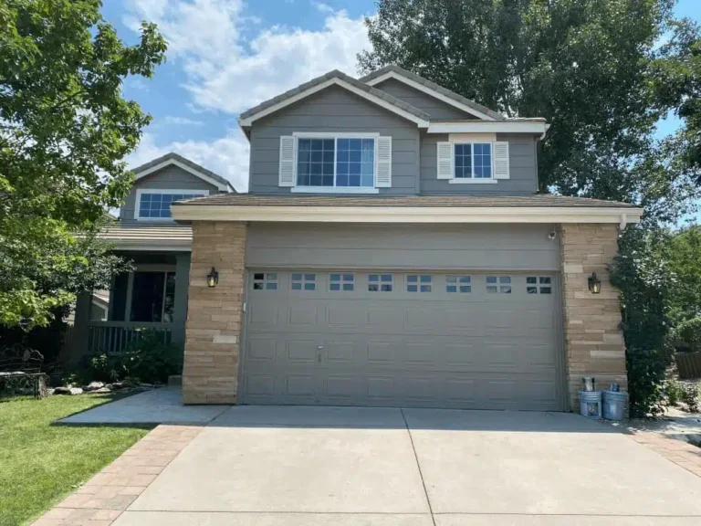 Painters applying an exterior coating to a Boise area home