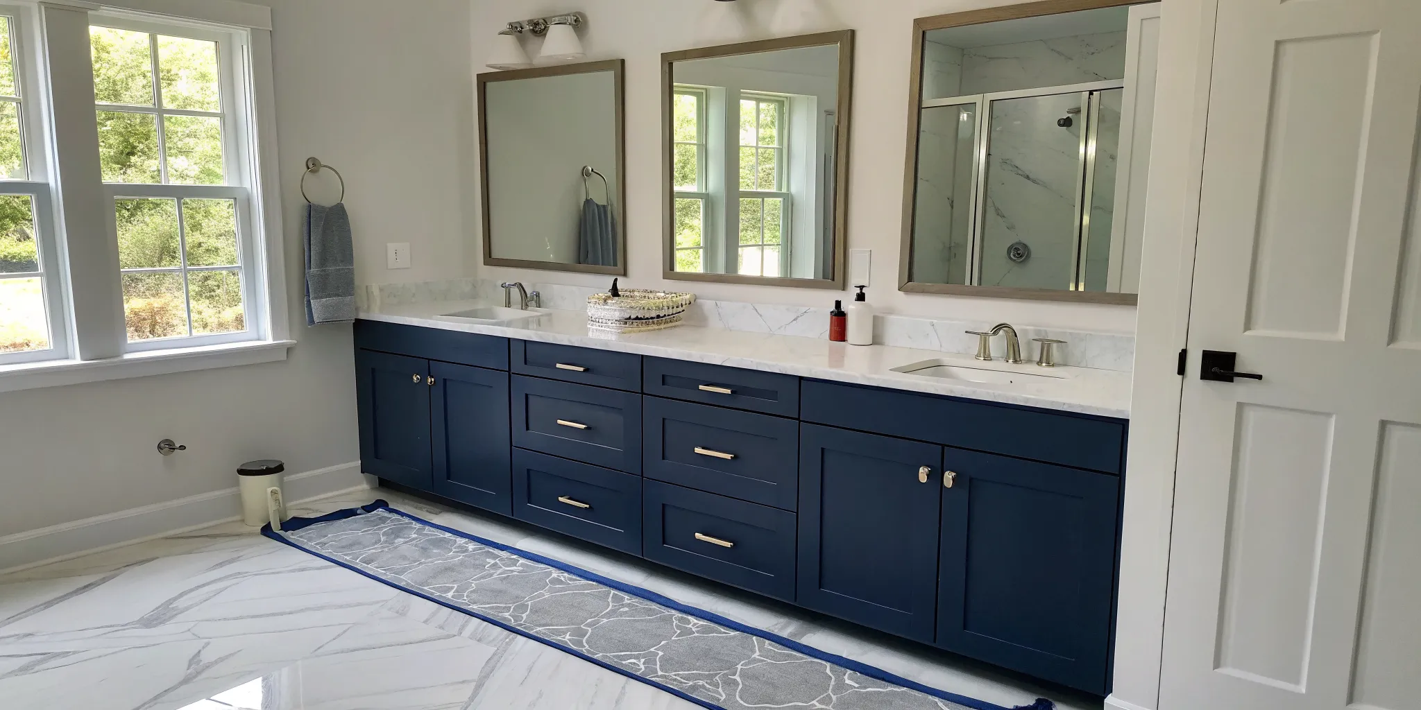 Navy blue bathroom cabinets with a smooth, professional finish by expert painters.